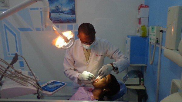 Dr. Saeed Jumah works on a patient