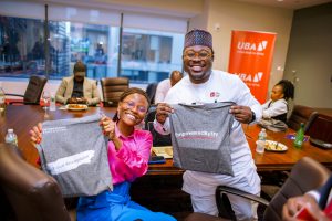 Entrepreneurs holding TEF Merch